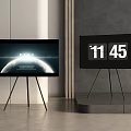 Two TVs on Tripod Stands Showing Planet Image HOME Text and 11 45 Time