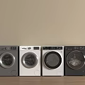 Four Modern Front Load Washing Machines in Gray and White Side by Side