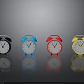 Row Of Colored Alarm Clocks With Bells White Dials On Gray Background With Reflections