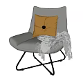 Comfortable Grey Single Sofa With Yellow Button Cushion And Fringed Grey Blanket On Metal Legs