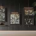 Black Framed Botanical Paintings With Floral Patterns Hanging On Dark Wooden Wall With Green Foliage