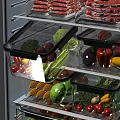Various Fresh Vegetables Neatly Stored in Clear Airtight Containers Inside Refrigerator Drawers