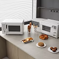 Modern White Kitchen Microwaves On Countertop With Baked Goods Utensils Window Blinds And Cabinets