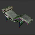 Cat Resting On Modern Black Chaise Lounge With Silver Metal Frame