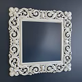 Ornate Golden Framed Square Mirror With Intricate Carvings On Blue Wall