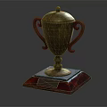Golden Trophy With Curved Handles Lid And Red Transparent Base For Champion First Place