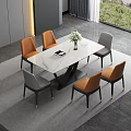 Modern Dining Table Set With White Marble Top And Orange Gray Chairs And Flower Vase
