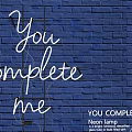White Neon Decorative Light with You Complete Me on Blue Brick Wall and Black Frame