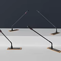 Four Professional Microphones With Black Poles And Square Brown Bases On Grey White Gradient Background