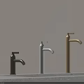 Elegant Modern Faucets With Black White Gold Finishes On Light Wall Countertop