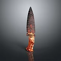 Ancient Textured Stone Spearhead Weapon with Sharp Pointed Blade and Wooden Handle Wrapped in Cord