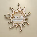 Decorative Mirror on Beige Wall with Irregular Sunburst Shaped Frame Reflecting Bedroom With Furniture