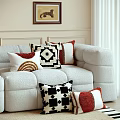 Decorative Throw Pillows On Cozy Sofa With Geometric Patterns Red White Black Colors 3d model