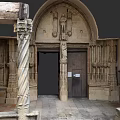 Historic Urban Architectural Building Entrance With Arched Doorway Carvings And Stone Columns