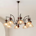 Vintage Chandelier With Multiple Transparent Glass Shades Metal Frame And Wooden Accents
