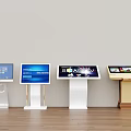Public Facility Featuring Four Different Style Touchscreen Information Kiosks on Wooden Floor Light Colored Wall
