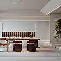 Modern Open Tea Room Interior With Wooden Long Table Red Cushions Bookshelf And Green Plants