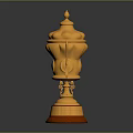 Elegant Golden Trophy With Ornate Carvings Lid Handles And Red Base Design