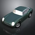 Vintage Green Sports Car With Rounded Body White Headlights And Silver Wheels
