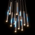 Modern Slim Tube Shaped Chandelier with Blue and White Lighting Effects Hanging in Black Background
