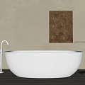 White Freestanding Oval Bathtub With Beige Wall Brown Artwork And Metal Towel Rack