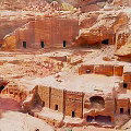 Ancient Rock-Cut Ruins In Red Rock Cliffs Historical Site With Cave Structures