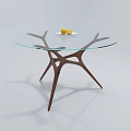 Glass Top Coffee Table With Modern Branched Brown Wood Legs And Fruit Decor Plate