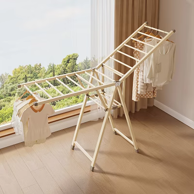 Indoor Clothes Drying Rack With Hanging Clothes By Window And Wooden Floor 3d model