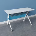 White Tabletop Desk With Blue Panel Sturdy White Frame And Wheels On Gray Floor