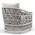 Elegant Single Sofa with Wicker Frame Gray Cushion and Dark Knitted Throw 3d model