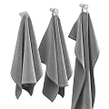 Soft Absorbent Cotton Towels Hanging On Metal Racks And Folded On Bathroom Countertop