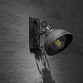 Vintage Industrial Wall Lamp With Metal Frame And Black Shade Casting Shadow On Wooden Wall