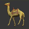 Yellow Camel Figurine With Red Decorative Saddle On Black Background