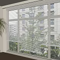 White Window Blinds in Bright Room with Wooden Floor Palm Plant and Green Trees View