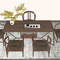 Traditional Wooden Tea Table And Chairs With Green Plant Vase And Tea Set