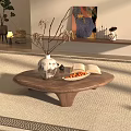 Oval Wooden Coffee Table With Unique Base Vase Dried Branches Open Book And Fruit Tray