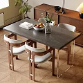 Modern Dining Table Set With White Cushioned Chairs Fruit Bowl Book And Vase