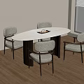 Contemporary Oval Dining Table With Grey Upholstered Chairs And Black Metal Legs