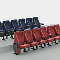 Modern Theater Seats Arranged In Blue And Red Rows With Armrests