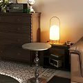 Round Metal Base Side Table With Lamp Books And Glass On Living Room Floor