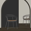 Modern Metal Frame Dining Chairs With Curved Design And Light Colored Seat In Arched Interior