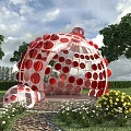 Red Spherical Art Installation In Outdoor Garden With Trees And Flowers