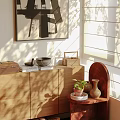 Modern Wooden Shelving Unit Displaying Ceramic Vases Bowls and Potted Plant in Sunlit Interior