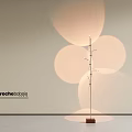 Modern Floor Lamp With Metal Stand Wooden Base And Circular Light Shadows