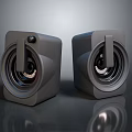 Modern Gray Cube Shaped Speakers With Compact Design And Reflective Surface For High Quality Sound