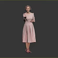 Senior woman wearing pink dress and pink shoes standing with gesturing hands on gray background