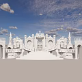 White Ornate Architectural Structure With Towers Arches And Carved Details Under Blue Sky