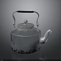 Silver Metal Kettle with Black Handle Round Lid and Spout as Essential Household Item