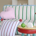 Colorful Living Space With Striped Sofa Pink Heart Pillow Pom Poms Green Lemon And Shell