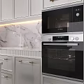 Modern Kitchen With White Cabinets Marble Countertop Gold Accents Island And Built in Appliances